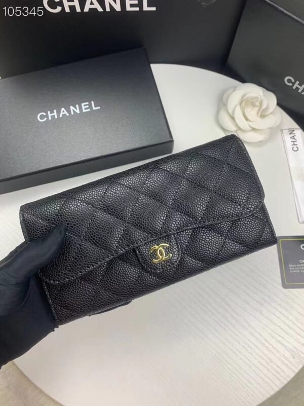 80758 (2) Chanel wallet in black caviar leather with gold hardware