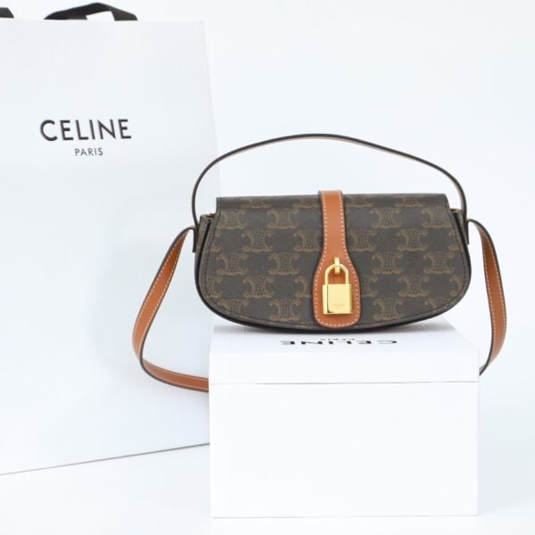 CELINE CLUTCH ON STRAP TABOU IN TRIOMPHE CANVAS AND CALFSKIN - TAN