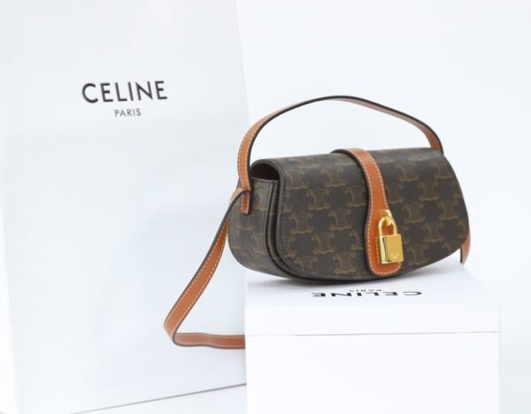 CELINE CLUTCH ON STRAP TABOU IN TRIOMPHE CANVAS AND CALFSKIN - TAN