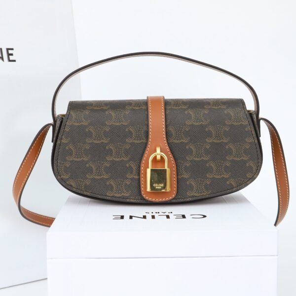 CELINE CLUTCH ON STRAP TABOU IN TRIOMPHE CANVAS AND CALFSKIN - TAN