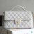 CHANEL AS5356 (1) CHANEL flap bag with top handle Lambskin White