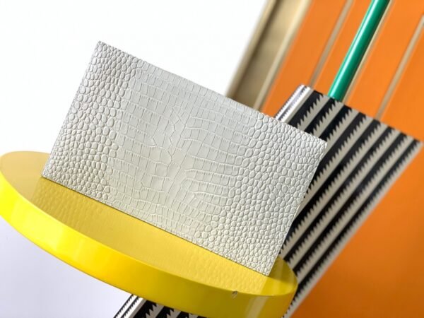 UPTOWN POUCH IN CROCODILE-EMBOSSED SHINY LEATHER