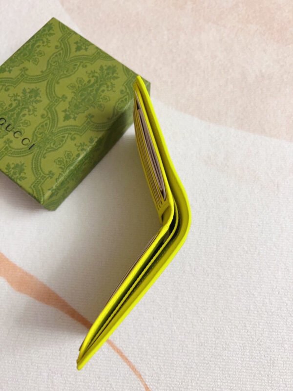 768243 FACQC 9742 (2) ACID GREEN INTERIOR GG BI-FOLD WALLET