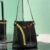 Prada Buckle leather bucket bag with jeweled belt
