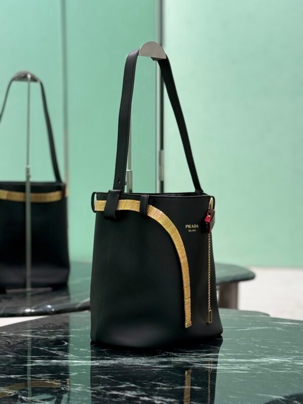 Prada Buckle leather bucket bag with jeweled belt