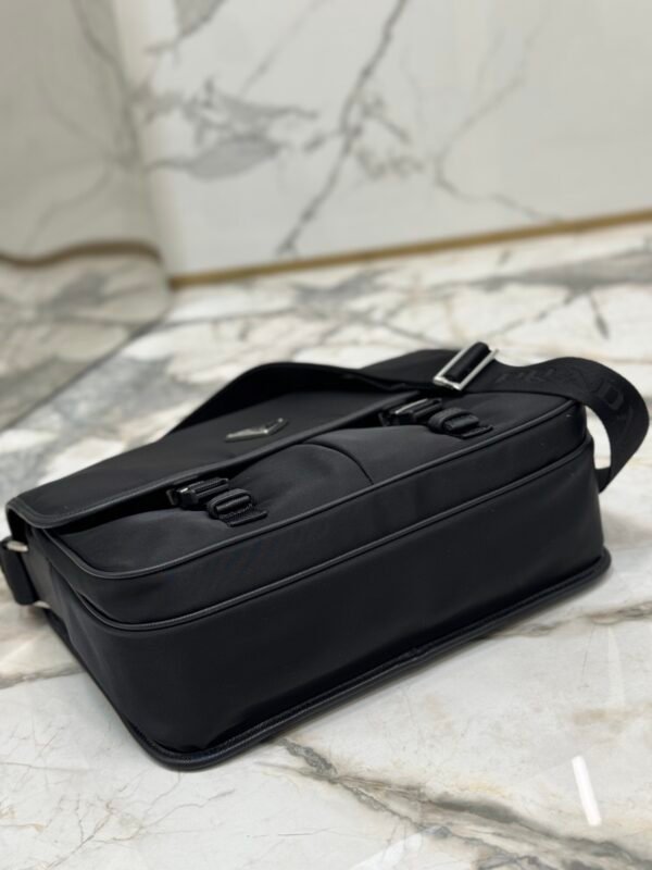 8328AC72B84D56E4ADDECA8349347C3C Re-Nylon and Saffiano leather shoulder bag